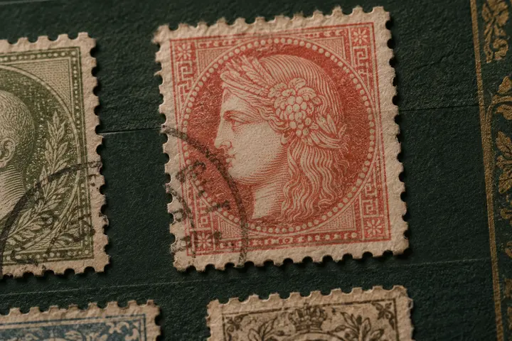Old stamps sorted in a philatelic album